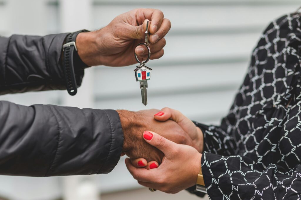 A first-time homebuyer receives their housekeys.